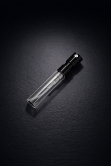 Empty sample 2 ml perfume bottle with black background