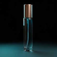 Clear perfume bottle gold cap on black blue background