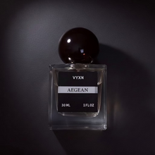 Perfume bottle AEGEAN on black studio background