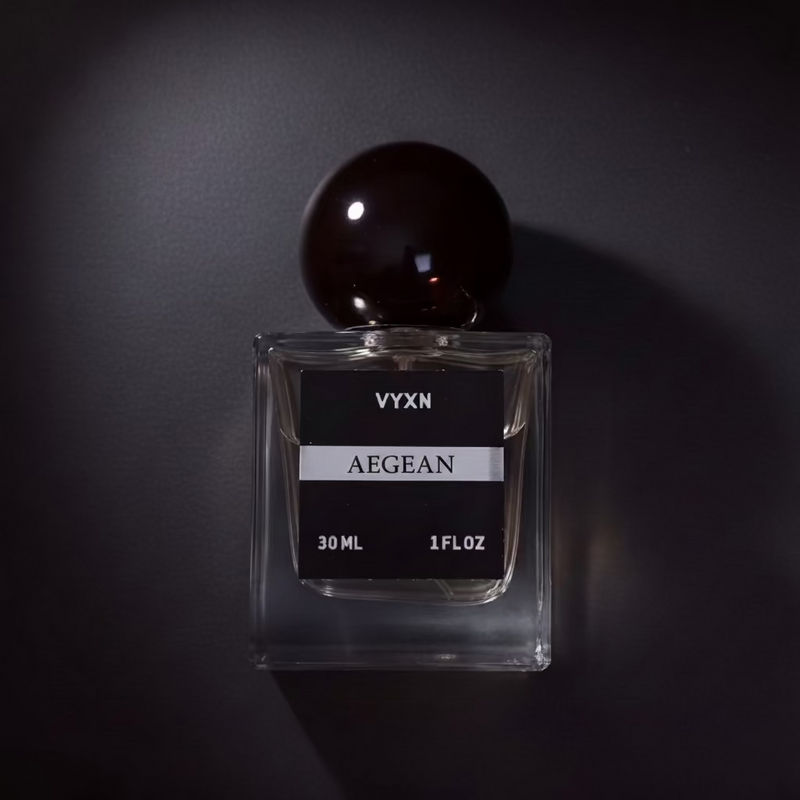 Perfume bottle AEGEAN on black studio background