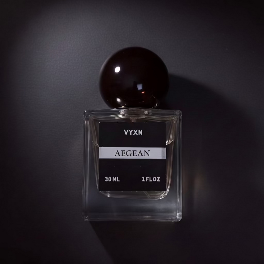 Perfume bottle AEGEAN on black studio background