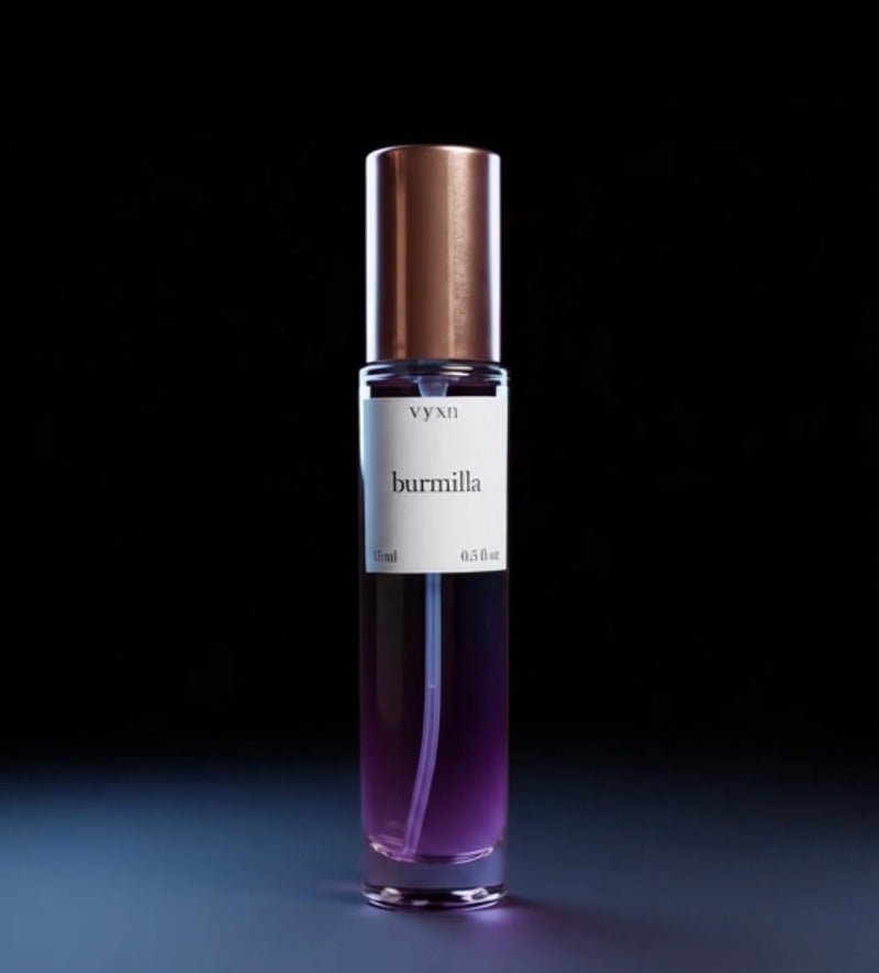 perfume bottle named “burmilla” 15ml 0.5fl.oz. Bottle on plum purple black background 