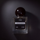 perfume bottle labeled snowshoe, black background