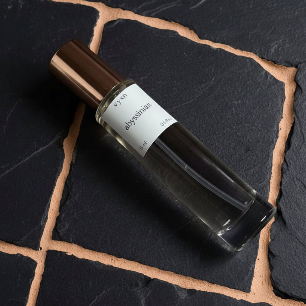 Perfume bottle on black slate background