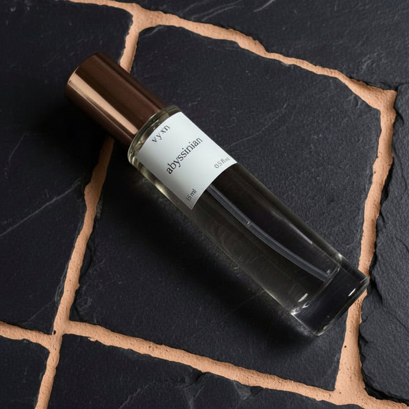 Perfume bottle on black slate background