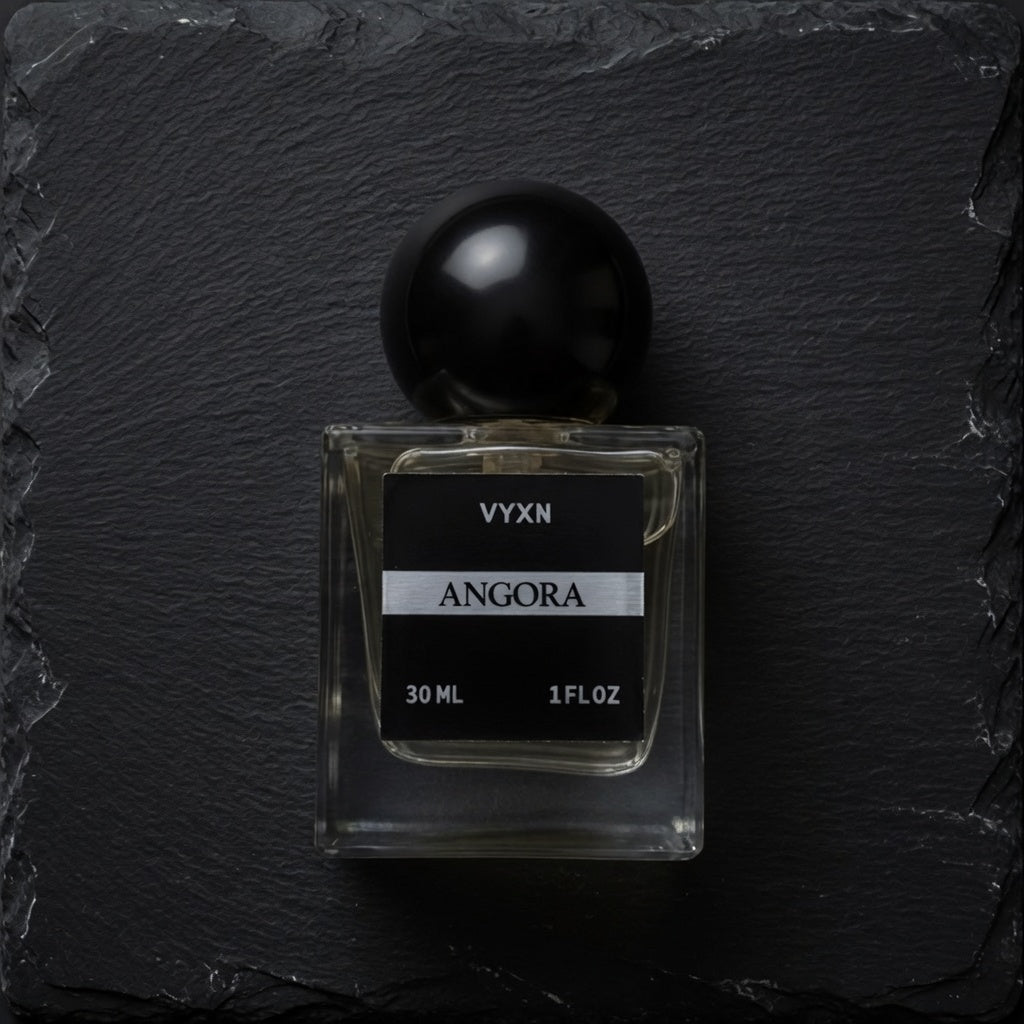 Angora perfume bottle black background. 