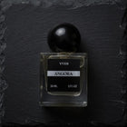 Angora perfume bottle black background. 