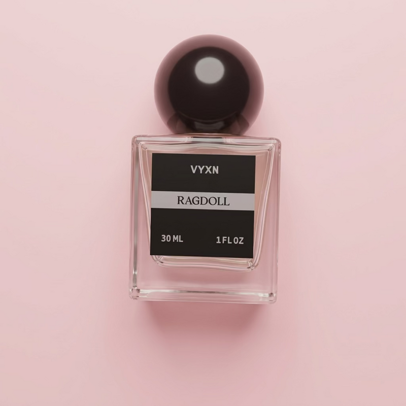 Perfume bottle labeled VYXN Ragdoll 30 ml 1 fl.oz. background white silk. label is back and silver
