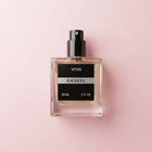 A 30 mL bottle of VYXN Ragdoll perfume with a black cap, placed on draped light pink satin fabric next to a round black stopper.
