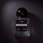 Perfume bottle labeled 'VYXN Abyssinian' on a dark background
