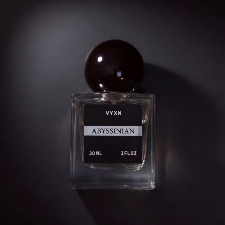 Perfume bottle labeled 'VYXN Abyssinian' on a dark background